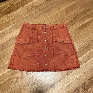 Rusty orange snap mini skirt